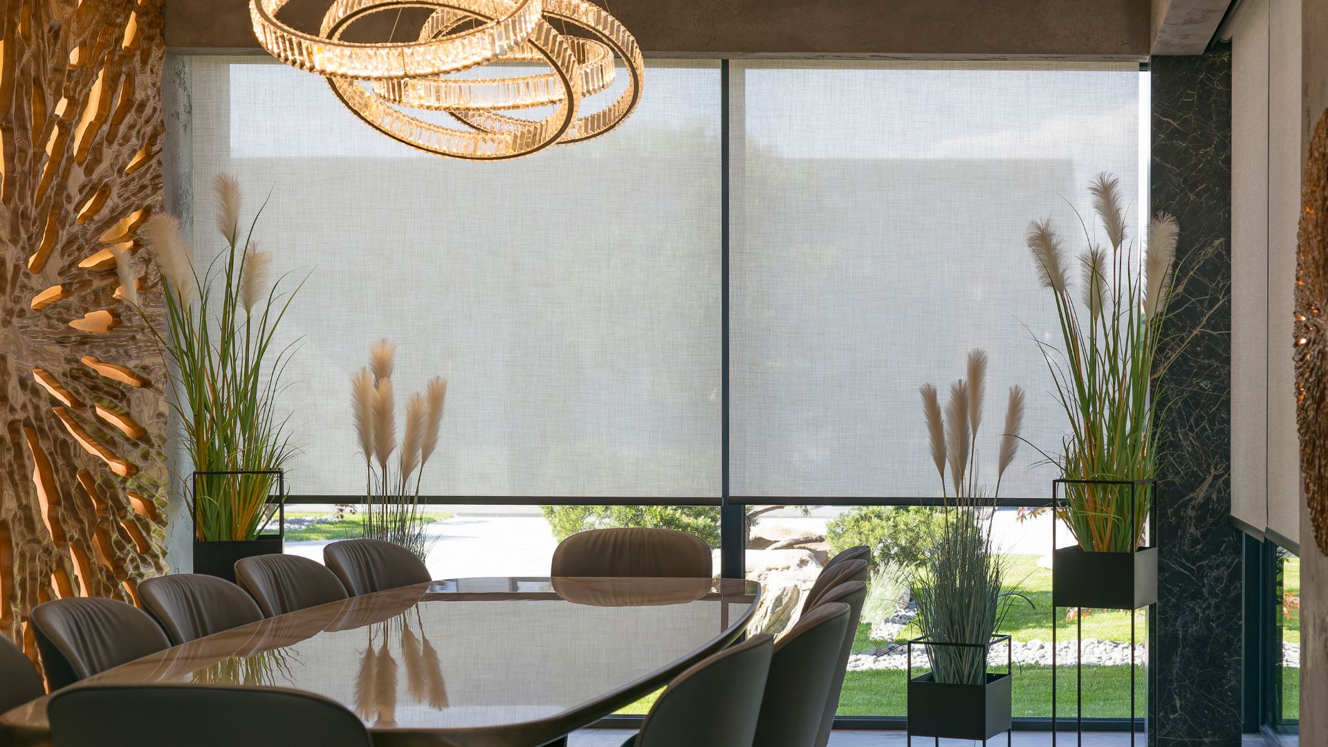 A dining room table with chairs and a chandelier