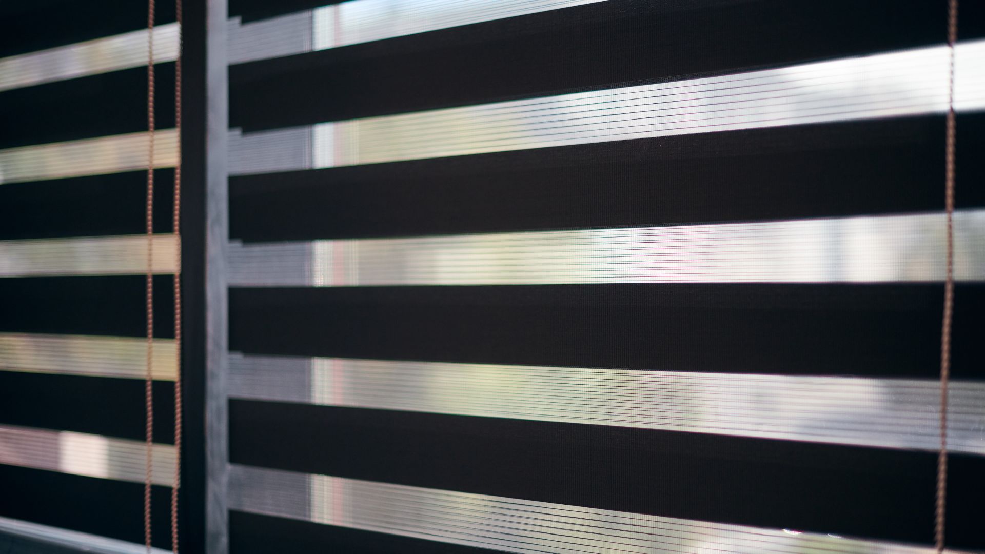 A close up of a window with blinds on it